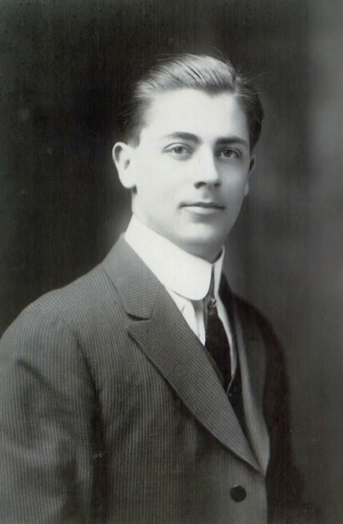 Archival portrait of a young man in a pinstripe suit from the Central Key & Safe family archive
